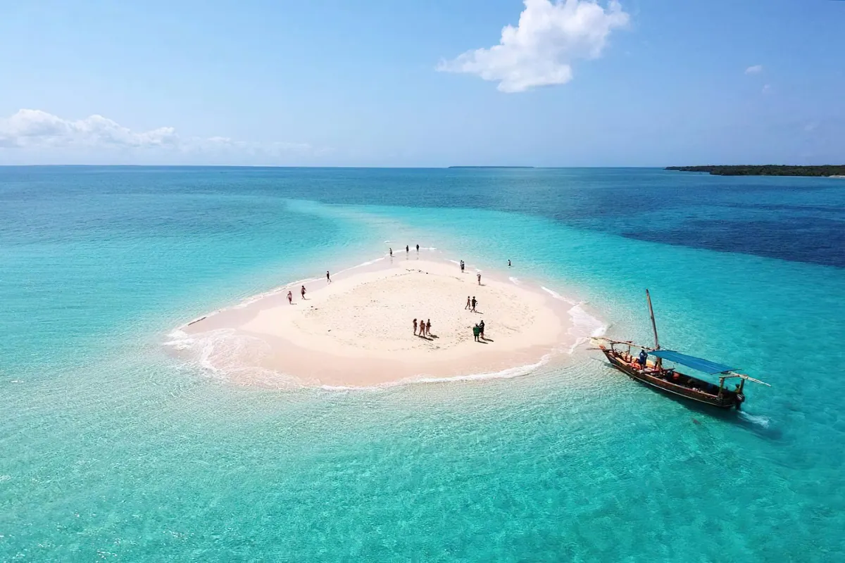 White sandbank and dhow in Zanzibar waters